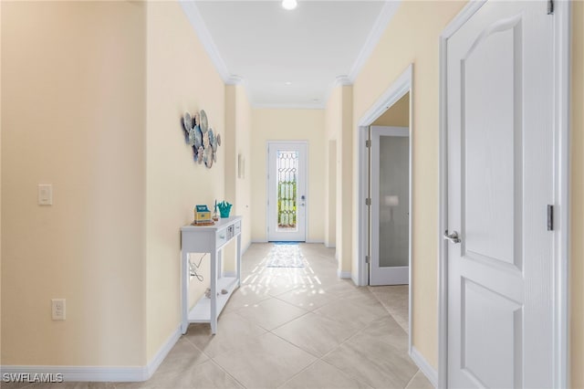 hall with crown molding and light tile patterned flooring