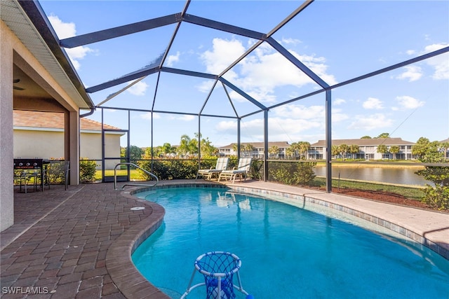 pool with a water view, a lanai, and a patio