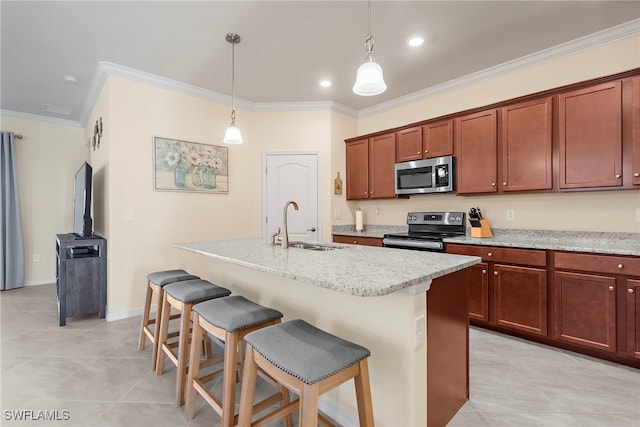 kitchen with ornamental molding, a breakfast bar, stainless steel appliances, pendant lighting, and a sink