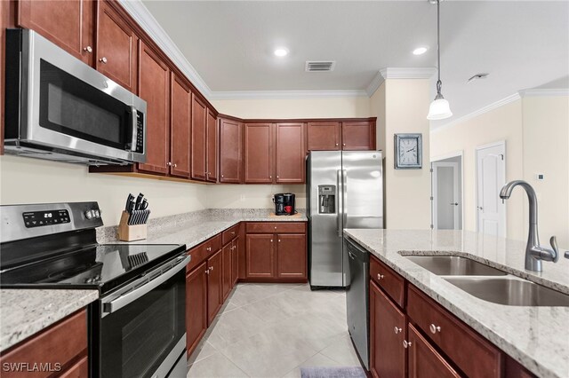 kitchen featuring light stone counters, stainless steel appliances, crown molding, sink, and pendant lighting