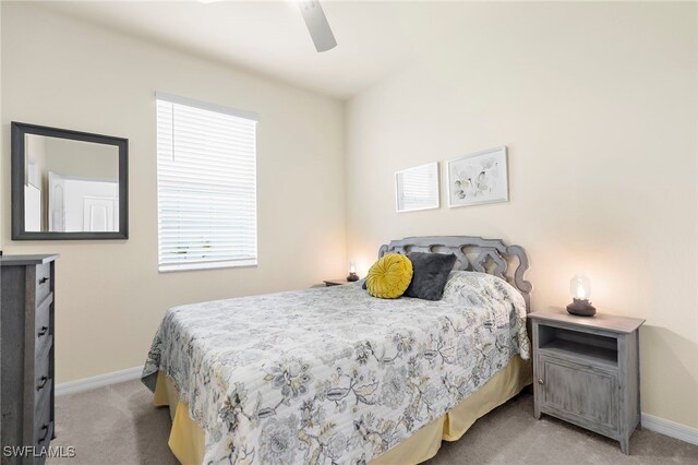 bedroom with carpet flooring, a ceiling fan, and baseboards