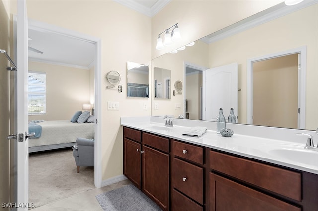 bathroom with crown molding, tile patterned flooring, and vanity