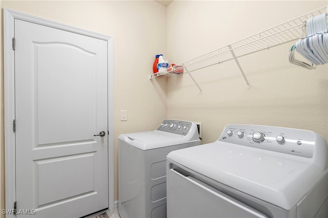 laundry room with laundry area and separate washer and dryer