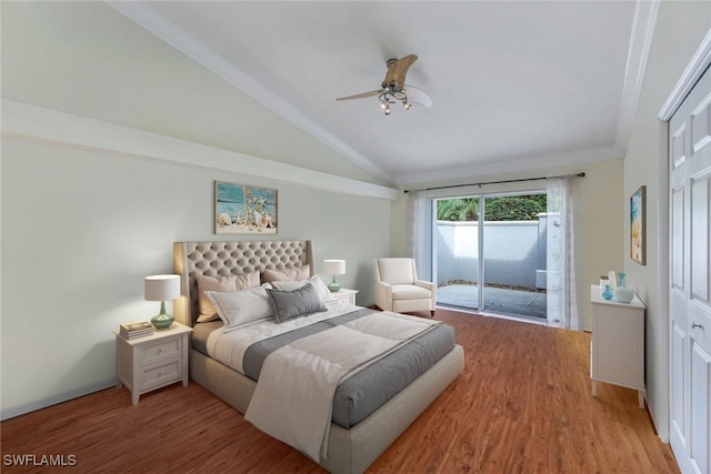 bedroom featuring access to exterior, light wood-type flooring, vaulted ceiling, and ceiling fan