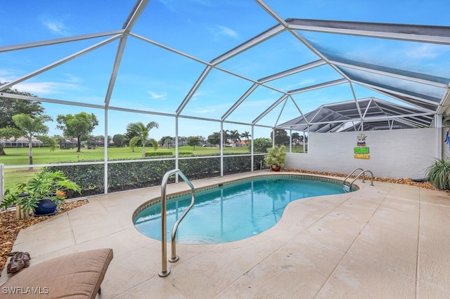 view of swimming pool featuring a lanai and a patio