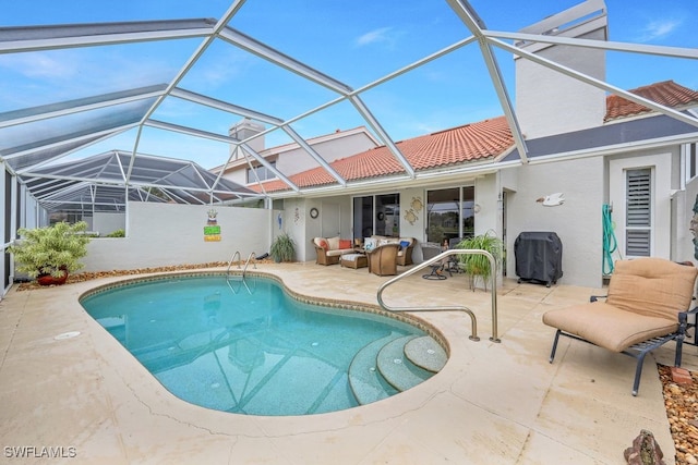 view of swimming pool with a patio area and glass enclosure