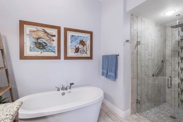 bathroom featuring shower with separate bathtub