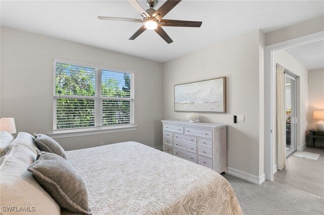 carpeted bedroom featuring ceiling fan