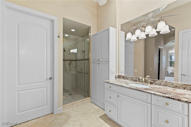 bathroom featuring vanity, tile patterned floors, and an enclosed shower