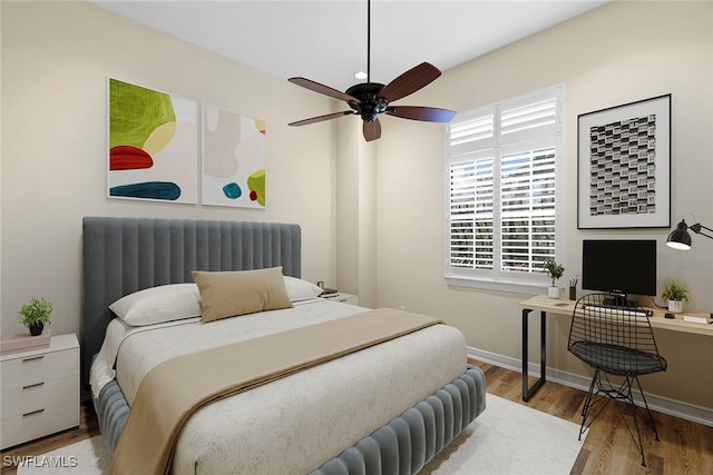 bedroom with light hardwood / wood-style flooring and ceiling fan