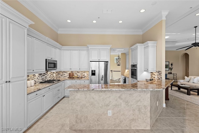 kitchen featuring kitchen peninsula, white cabinetry, and appliances with stainless steel finishes