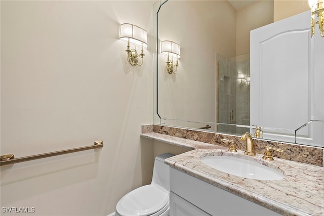 bathroom with vanity, toilet, and walk in shower