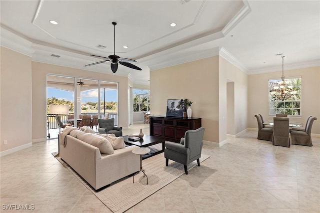 living room featuring crown molding, a raised ceiling, and baseboards