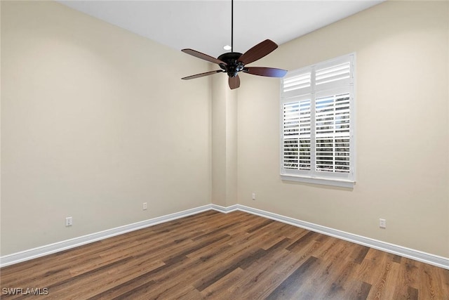 empty room with baseboards, a ceiling fan, and wood finished floors