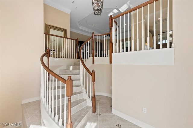 28551 Calabria Ct Unit 202, Naples, FL 34110 - stairway featuring crown molding, baseboards, and tile patterned flooring