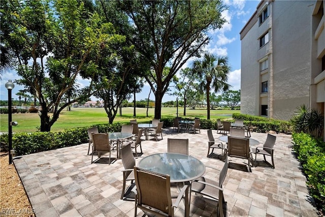 7430 Lake Breeze Dr Unit 402, Fort Myers, FL 33907 - view of patio with outdoor dining area