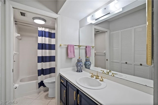 full bathroom with tile patterned floors, shower / bath combo with shower curtain, vanity, and toilet