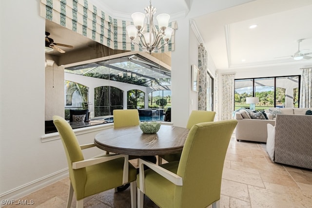 dining space featuring crown molding and ceiling fan with notable chandelier