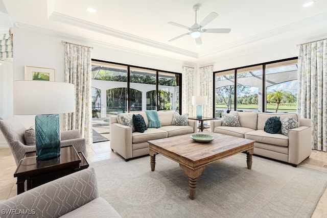 tiled living room featuring crown molding and ceiling fan