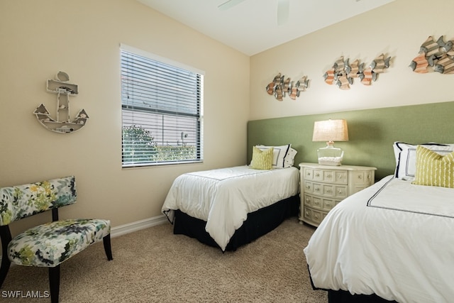 bedroom with ceiling fan and carpet floors