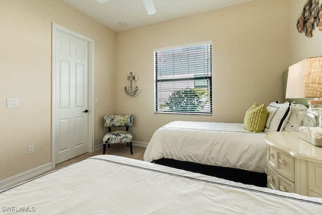 bedroom featuring ceiling fan and carpet floors