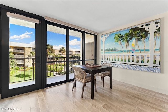 sunroom with a water view