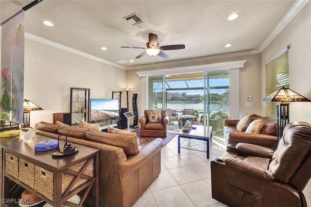 living room featuring ceiling fan, ornamental molding, and light tile patterned flooring