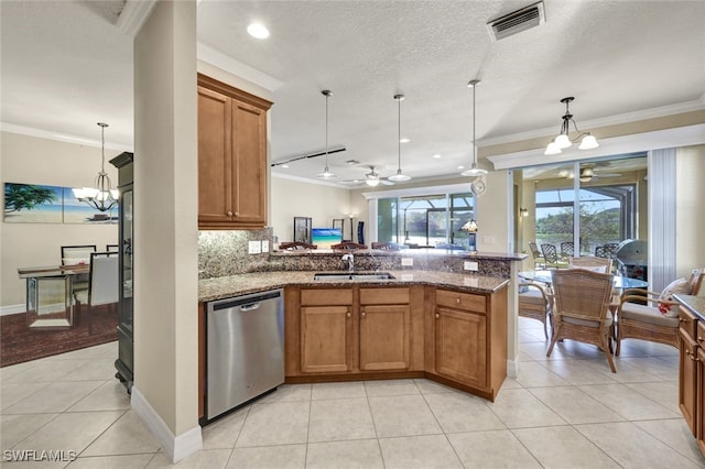 kitchen featuring ornamental molding, sink, pendant lighting, stone counters, and dishwasher