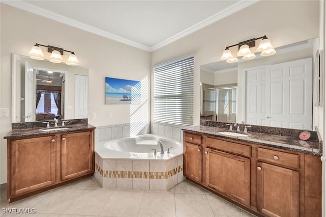 bathroom featuring tile patterned floors, vanity, ornamental molding, and shower with separate bathtub