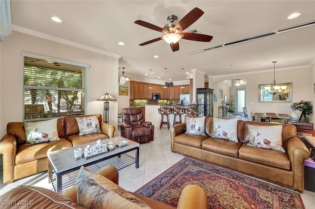 living room with crown molding, light tile patterned floors, and ceiling fan with notable chandelier