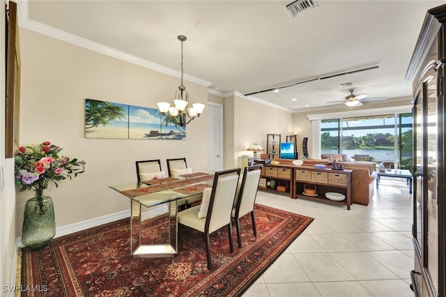 dining room with light tile patterned floors, ceiling fan with notable chandelier, and ornamental molding