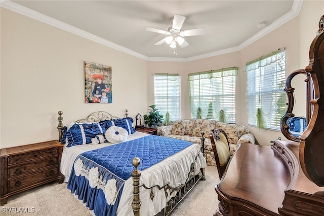 carpeted bedroom with ceiling fan and crown molding