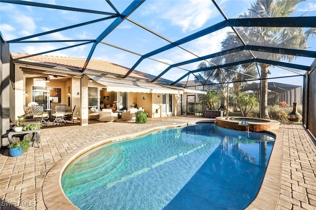 view of swimming pool featuring a lanai, outdoor lounge area, an in ground hot tub, and a patio