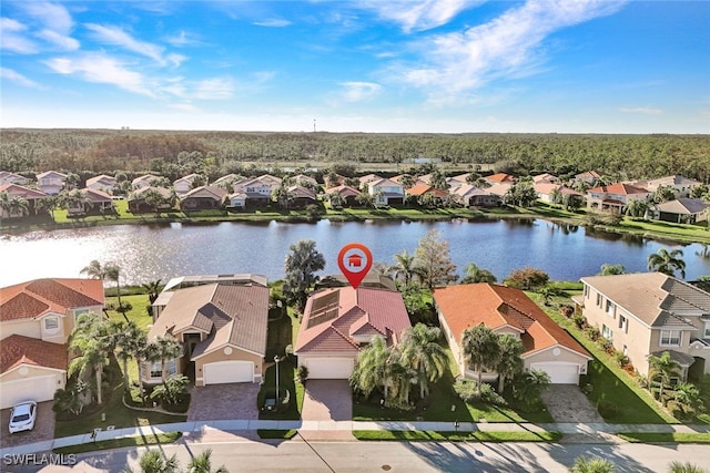 birds eye view of property featuring a water view