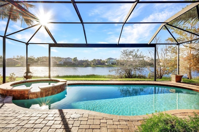 view of swimming pool featuring an in ground hot tub, a water view, and a lanai