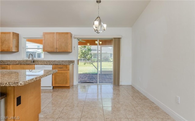 kitchen with dishwasher, decorative light fixtures, plenty of natural light, and sink