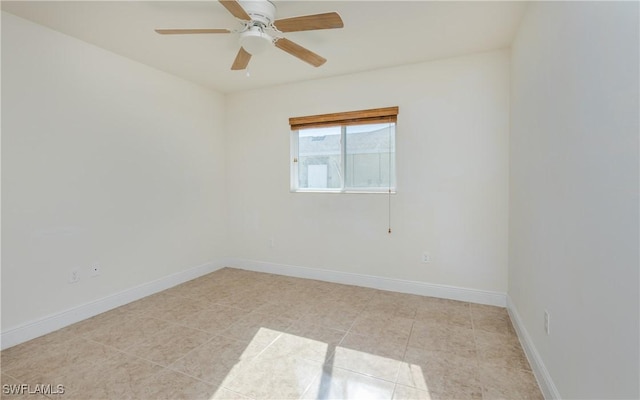 unfurnished room with light tile patterned floors and ceiling fan