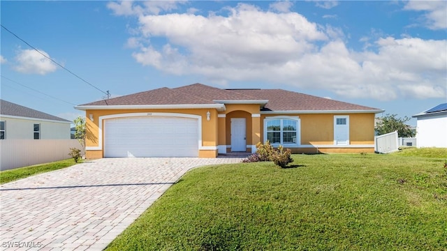 view of front facade with a garage and a front lawn