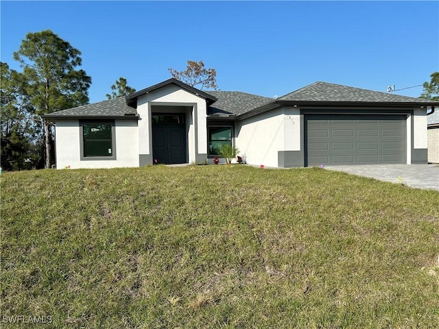 view of front of property featuring a garage and a front lawn