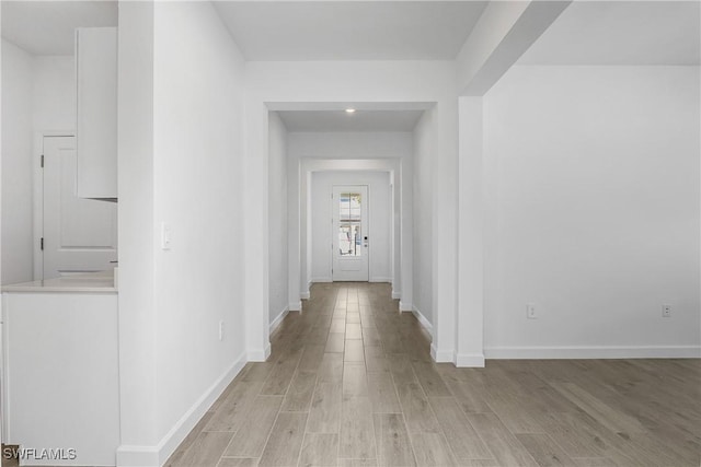 21079 Hallandale Dr, Estero, FL 33928 - corridor featuring light wood-type flooring and baseboards