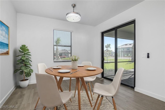 dining area with hardwood / wood-style floors