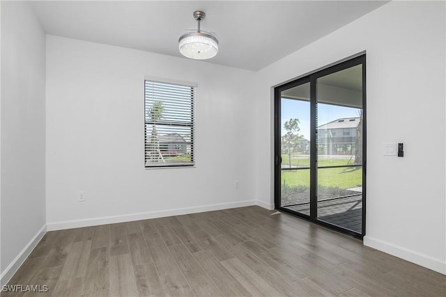 spare room with hardwood / wood-style flooring