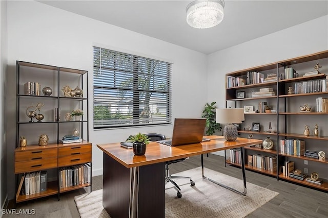 office featuring hardwood / wood-style floors and a notable chandelier