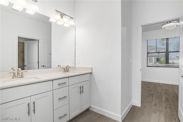 bathroom with hardwood / wood-style floors and vanity