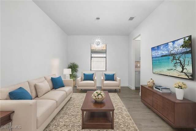 21079 Hallandale Dr, Estero, FL 33928 - living area featuring light wood finished floors and a chandelier