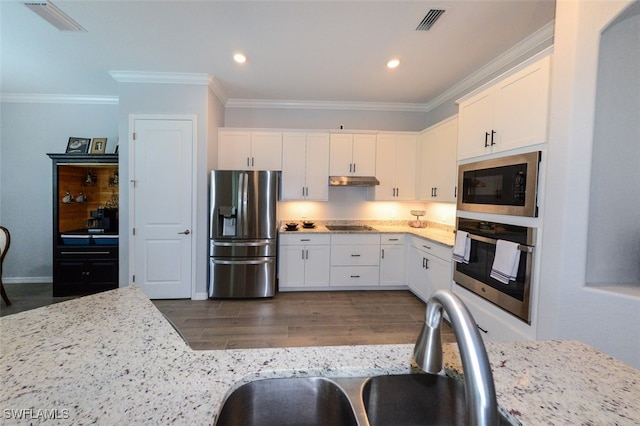 kitchen featuring light stone countertops, appliances with stainless steel finishes, sink, and white cabinets