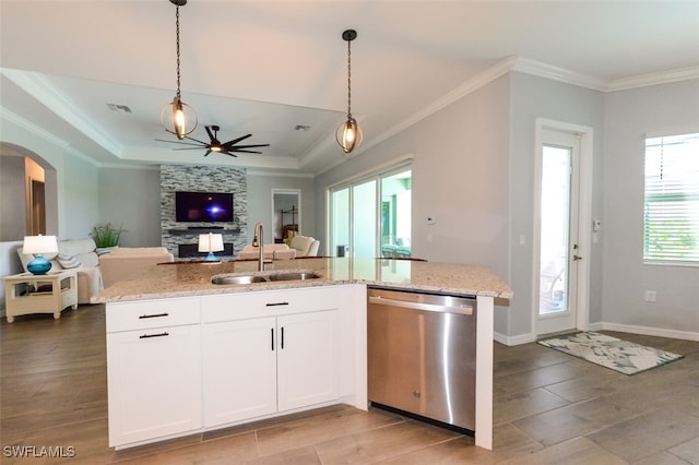 kitchen featuring white cabinetry, light stone countertops, sink, and stainless steel dishwasher