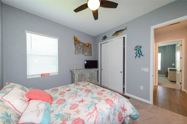 bedroom featuring ceiling fan, carpet floors, and a closet