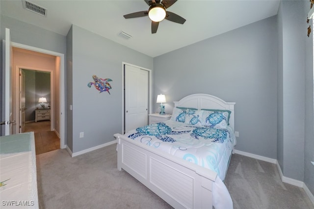 carpeted bedroom with ceiling fan