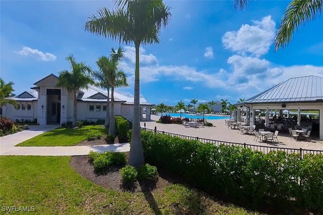 surrounding community featuring a gazebo, a yard, and a swimming pool